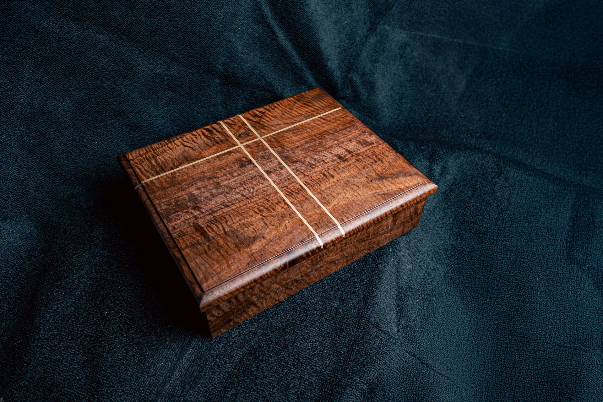 Handcrafted wooden box with contrasting linear inlay