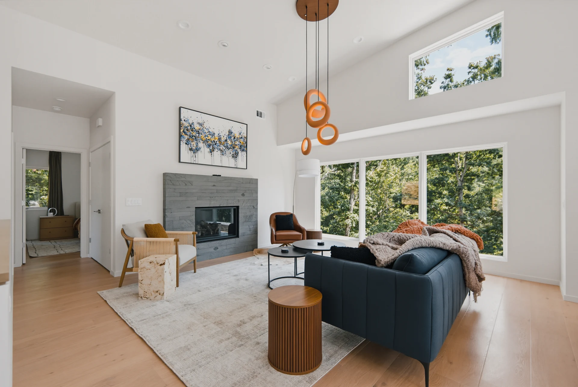 Living room with a fireplace and exposed wood ceiling beams