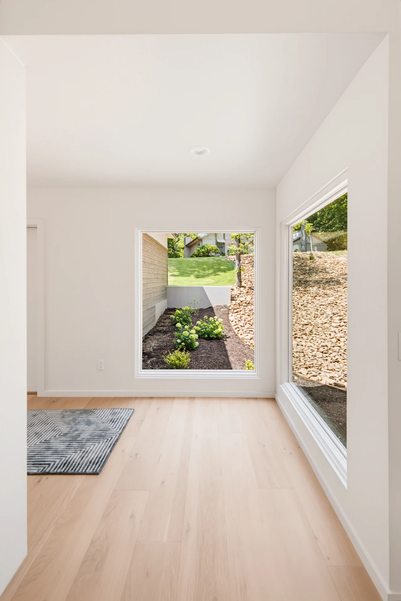 Bright entry hall looking out toward the landscape