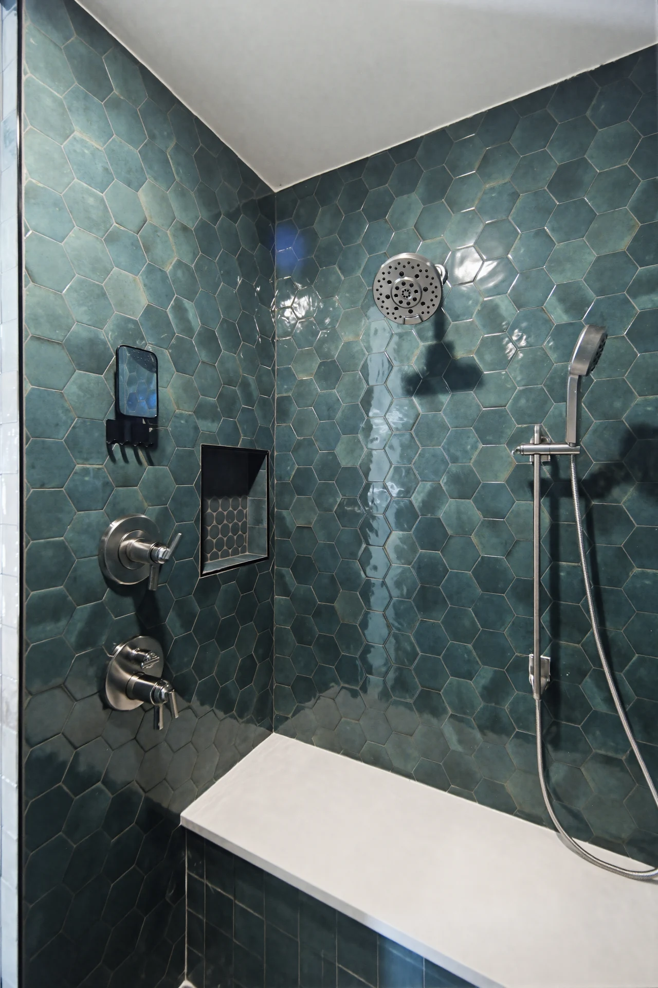 Shower tile, glass enclosure, and built-in bench