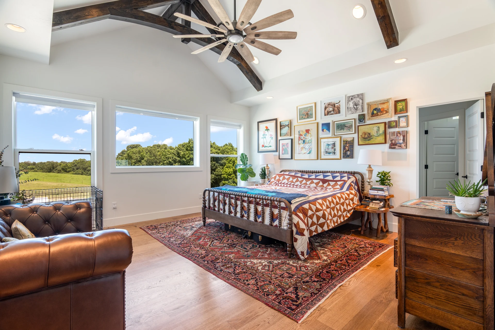 Bedroom with timber beams and large windows