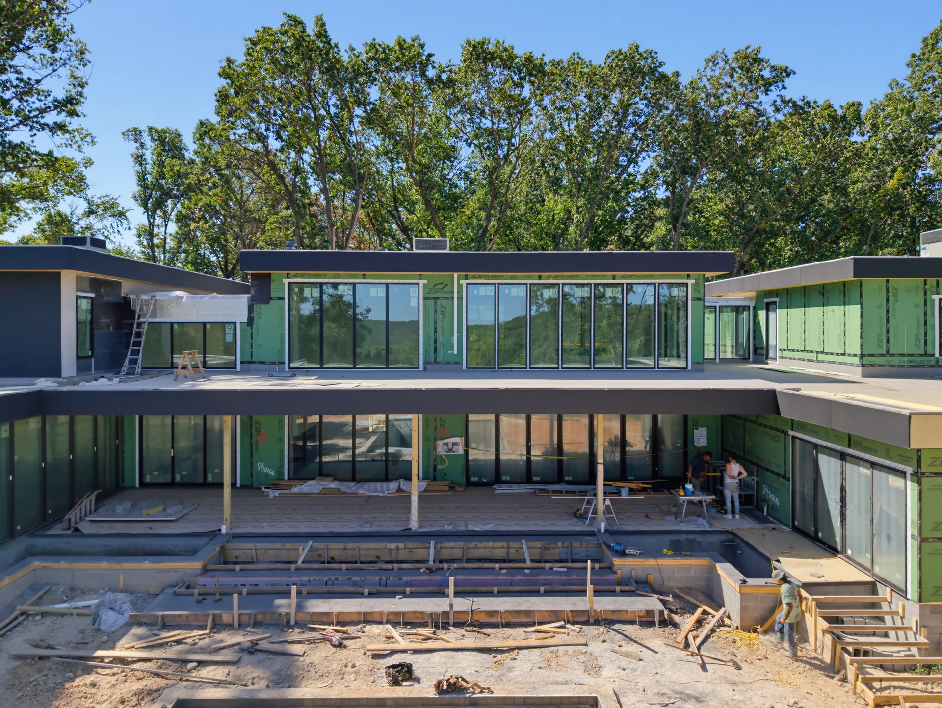 Glazed elevations and stepped rooflines during construction