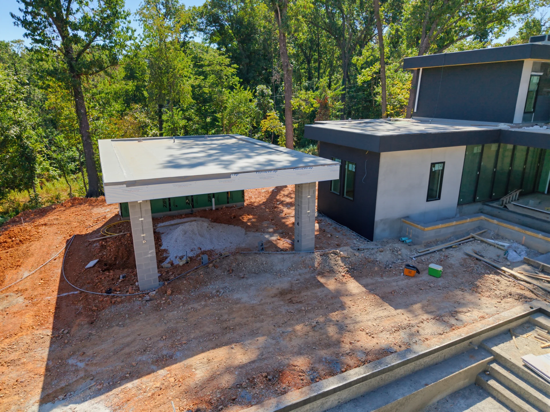 Entry approach and flat roof during construction